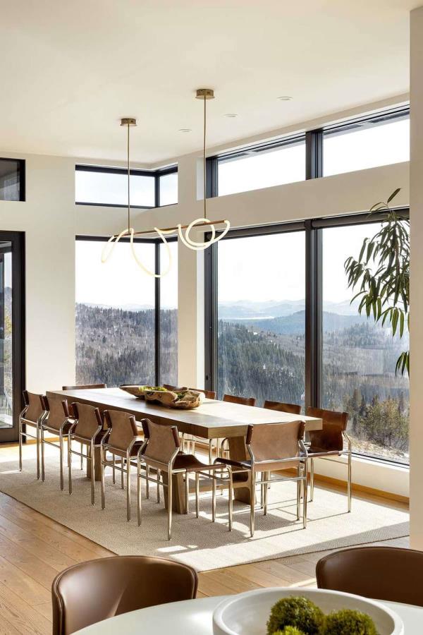 open-plan dining room table anchored with area rug