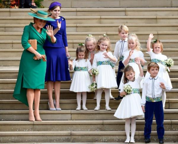 Princess Beatrice is seen smiling next to Charlotte at her sister's wedding in 2018