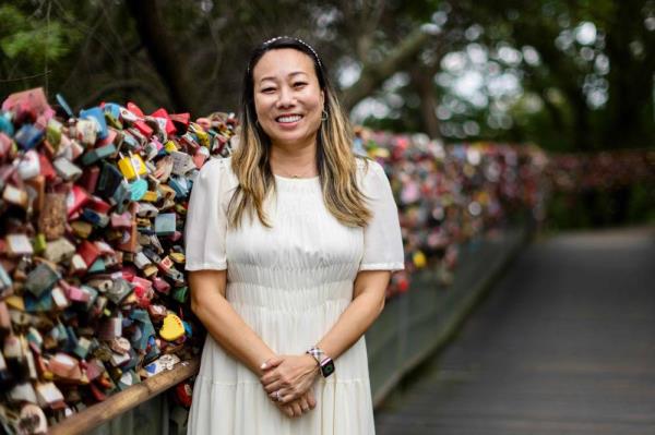 South Korean-US therapist Jeanie Chang, who also runs K-drama tours, poses next to 'Love Locks' at the landmark Namsan Tower in Seoul. Photo by Anthony Wallace/AFP