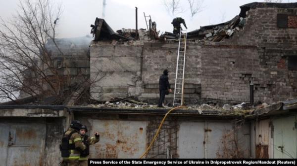 Firefighters work at the site of a Russian missile strike, amid Russia's attack on Ukraine, in Dnipro, Ukraine, Nov. 21, 2024.